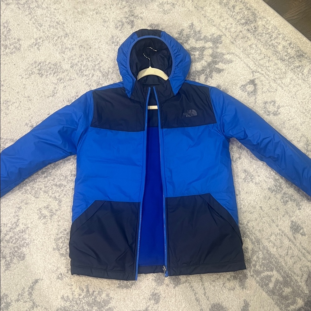 The North Face Blue and Navy Jacket reversible. One side is water resistant